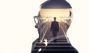 Double exposure of a businessman and stairs. Success of business concept.